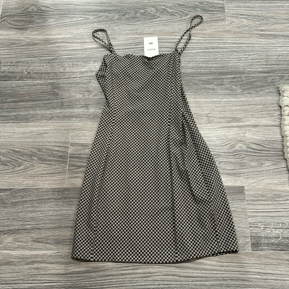 Brand new never worn RVCA dress with criss cross back.  Black and cream.